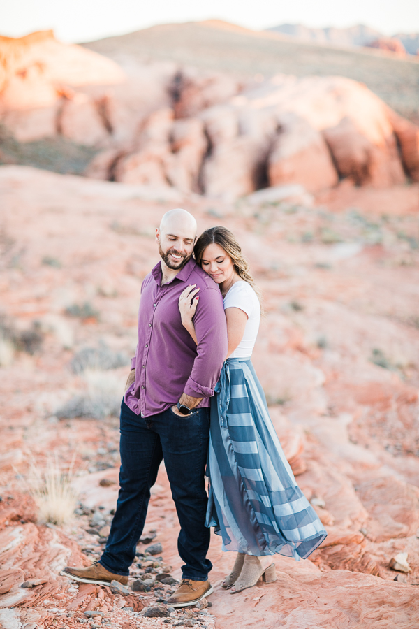 a couple cuddles during Valley of Fire engagement session