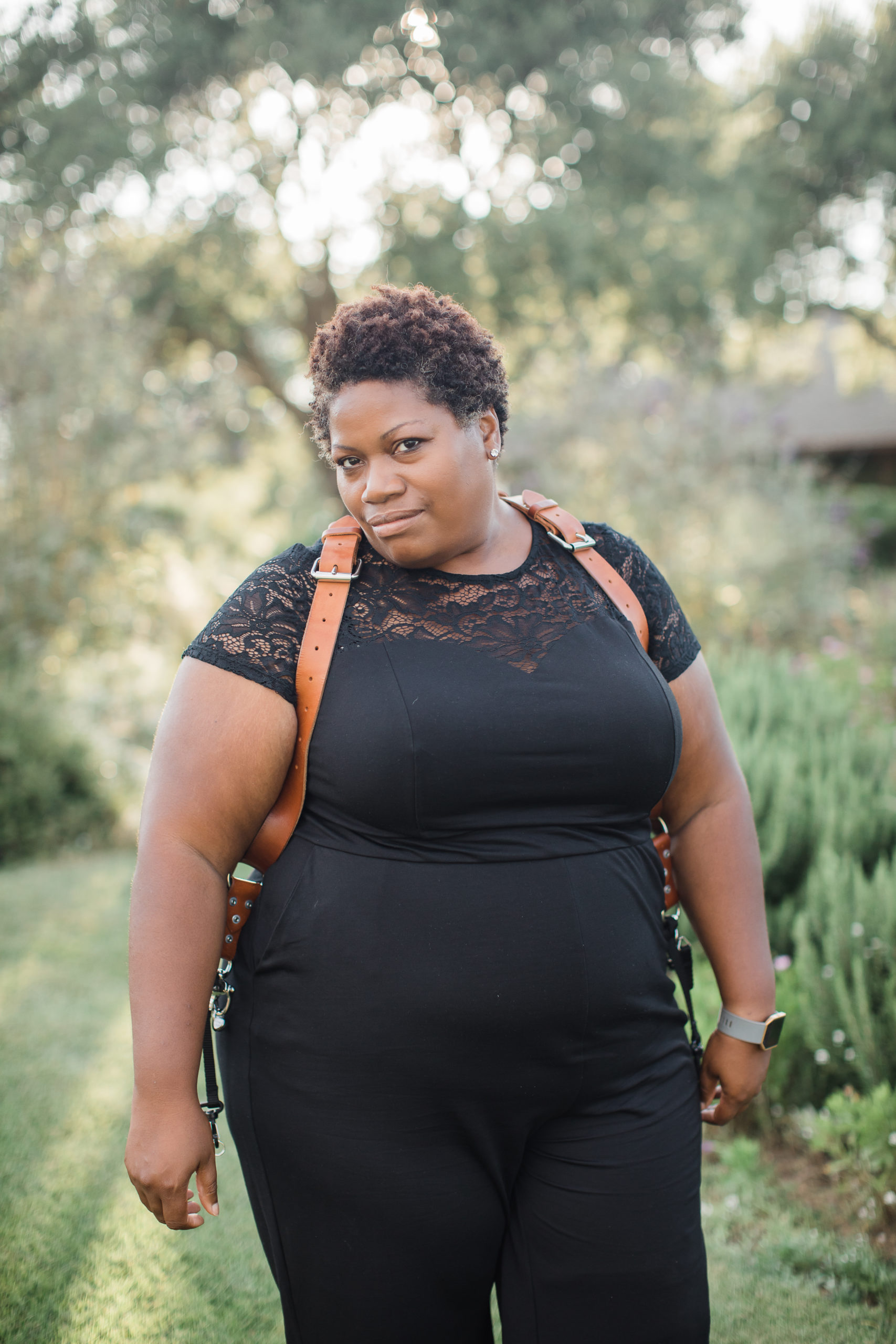 Ty Pentecost in a black jumpsuit from Torrid - what to wear to photograph weddings