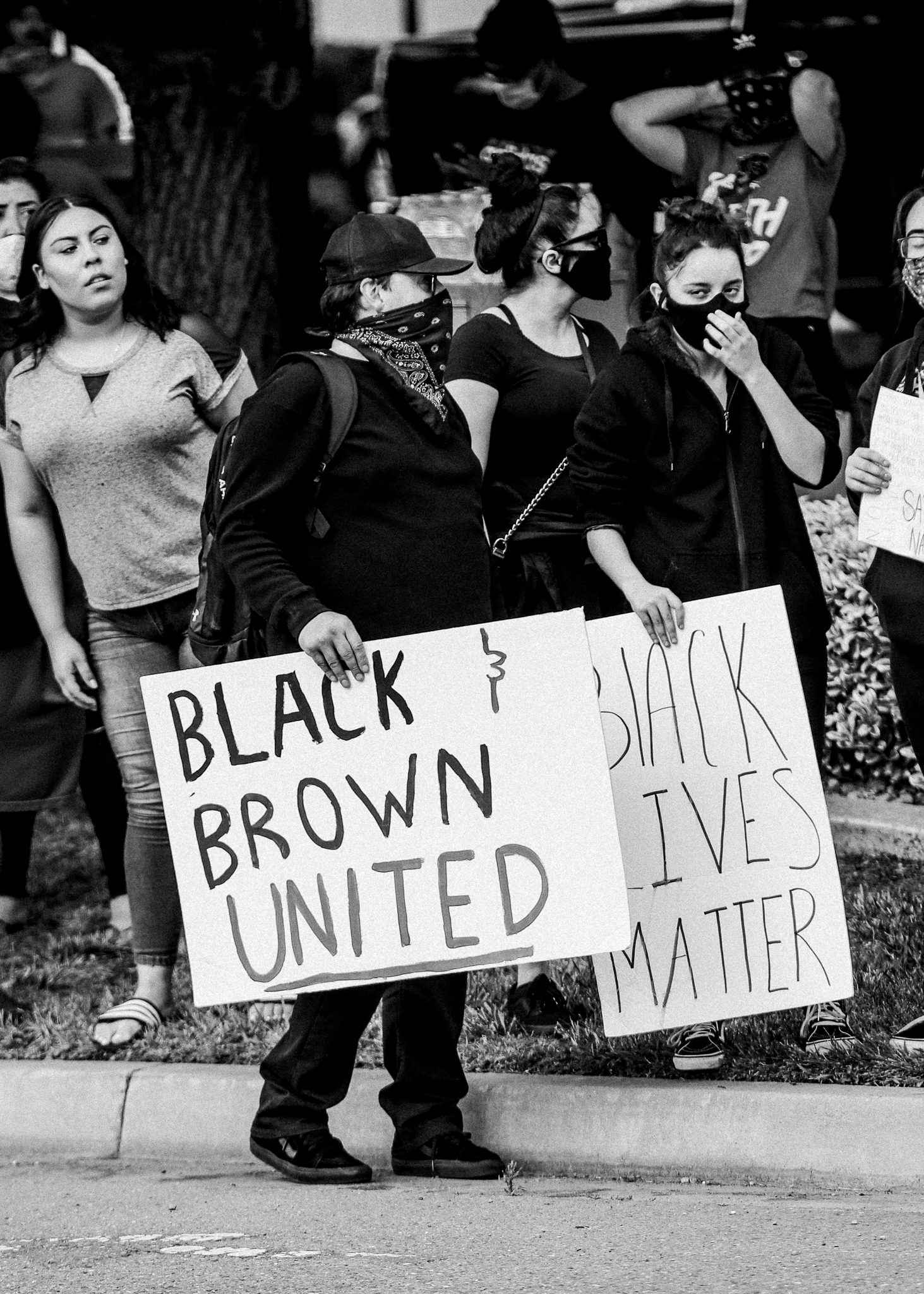 protest signs - black, brown, united and black lives matter